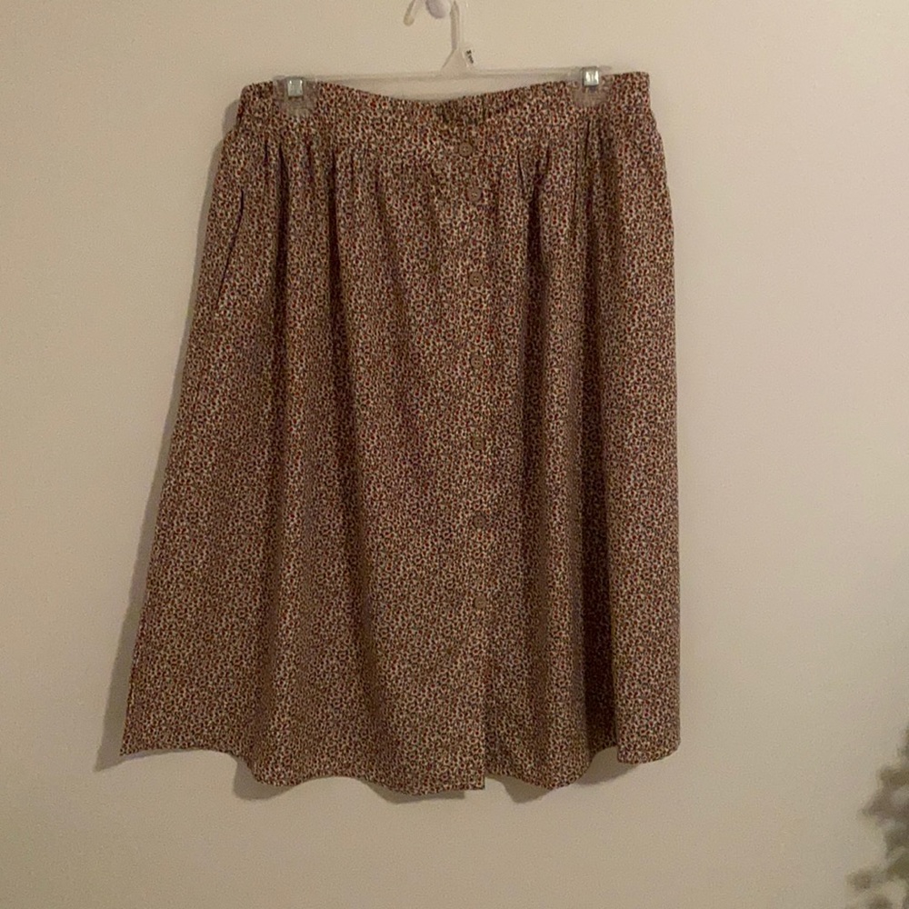 Pleated floral button-up skirt.